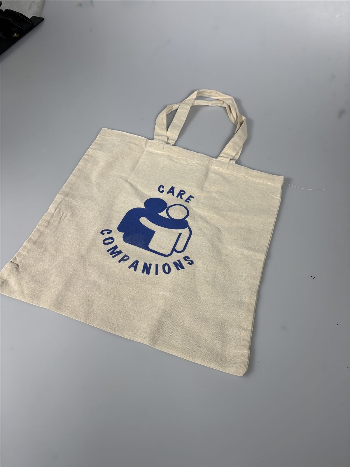 Care Companions tote bag, blue logo colourway