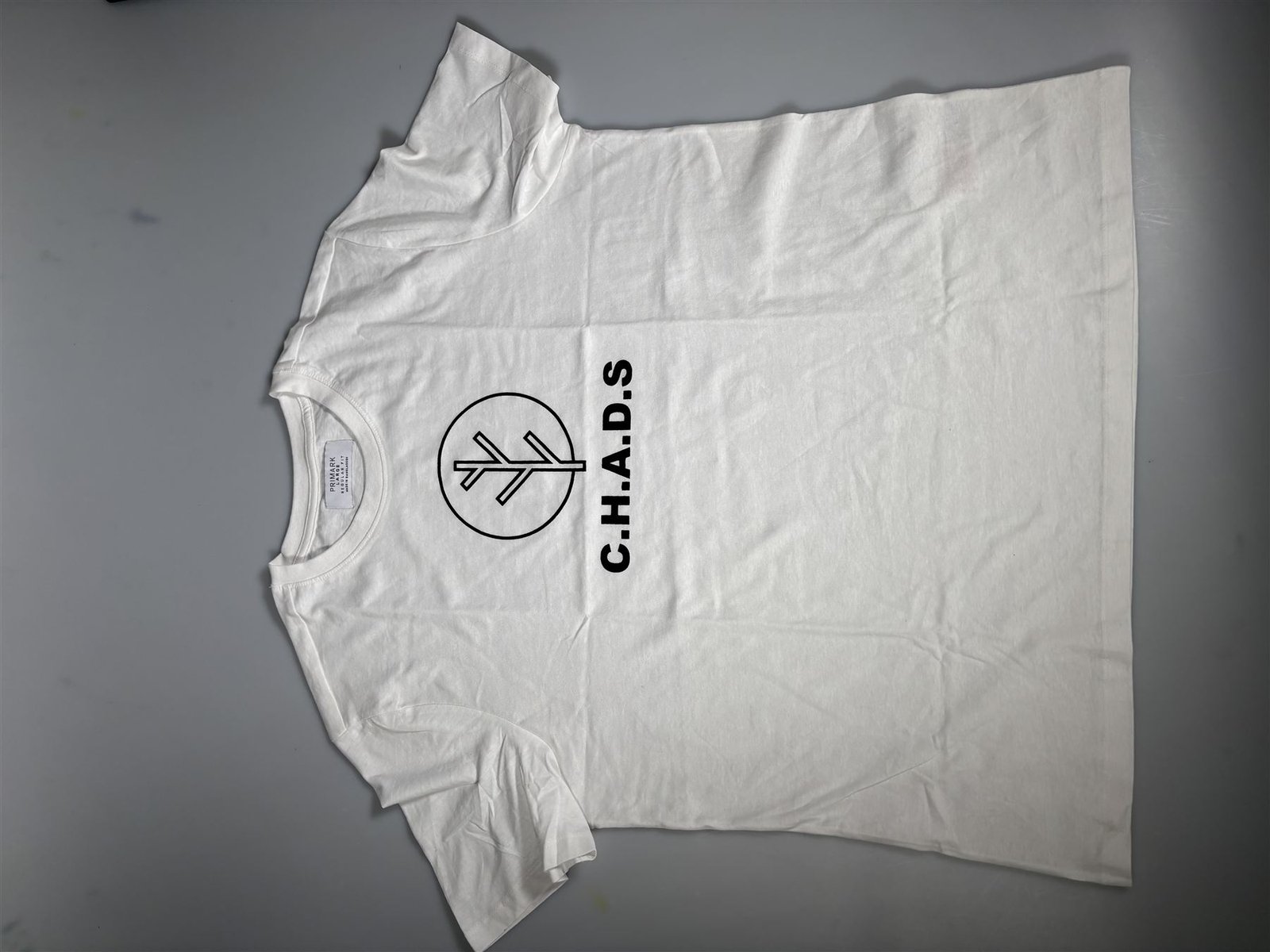 Screen-printed C.H.A.D.S logo on a white T-shirt