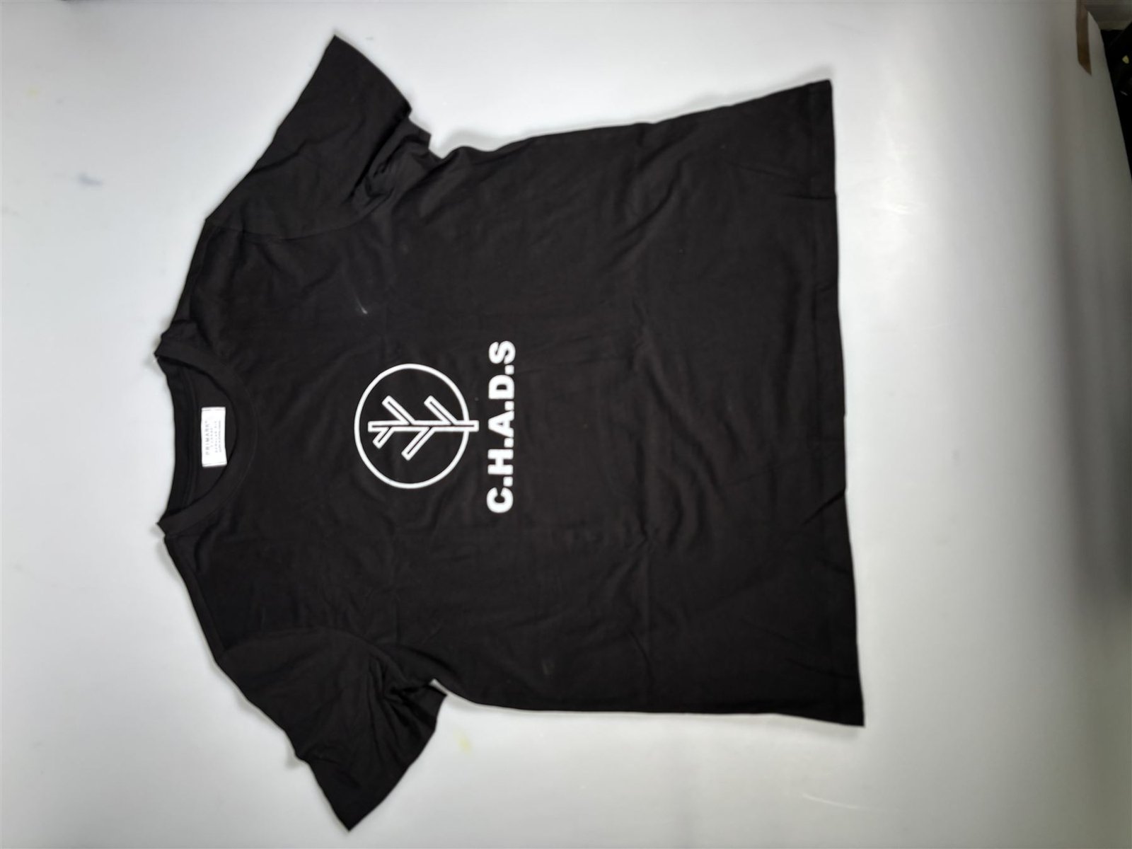 Screen-printed C.H.A.D.S logo on a black T-shirt